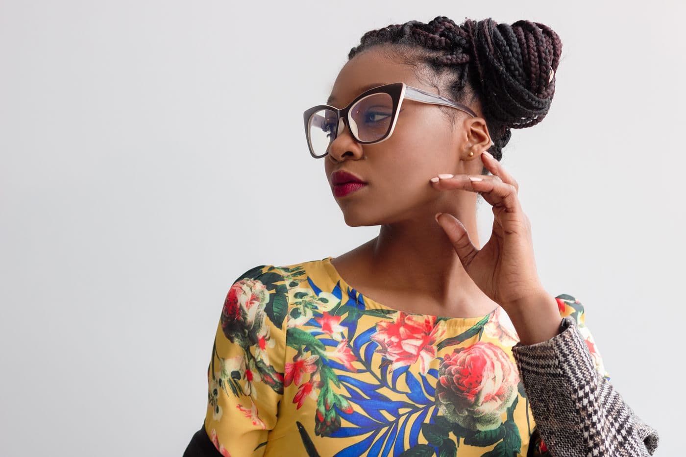 A woman wearing bold cat-eye frames